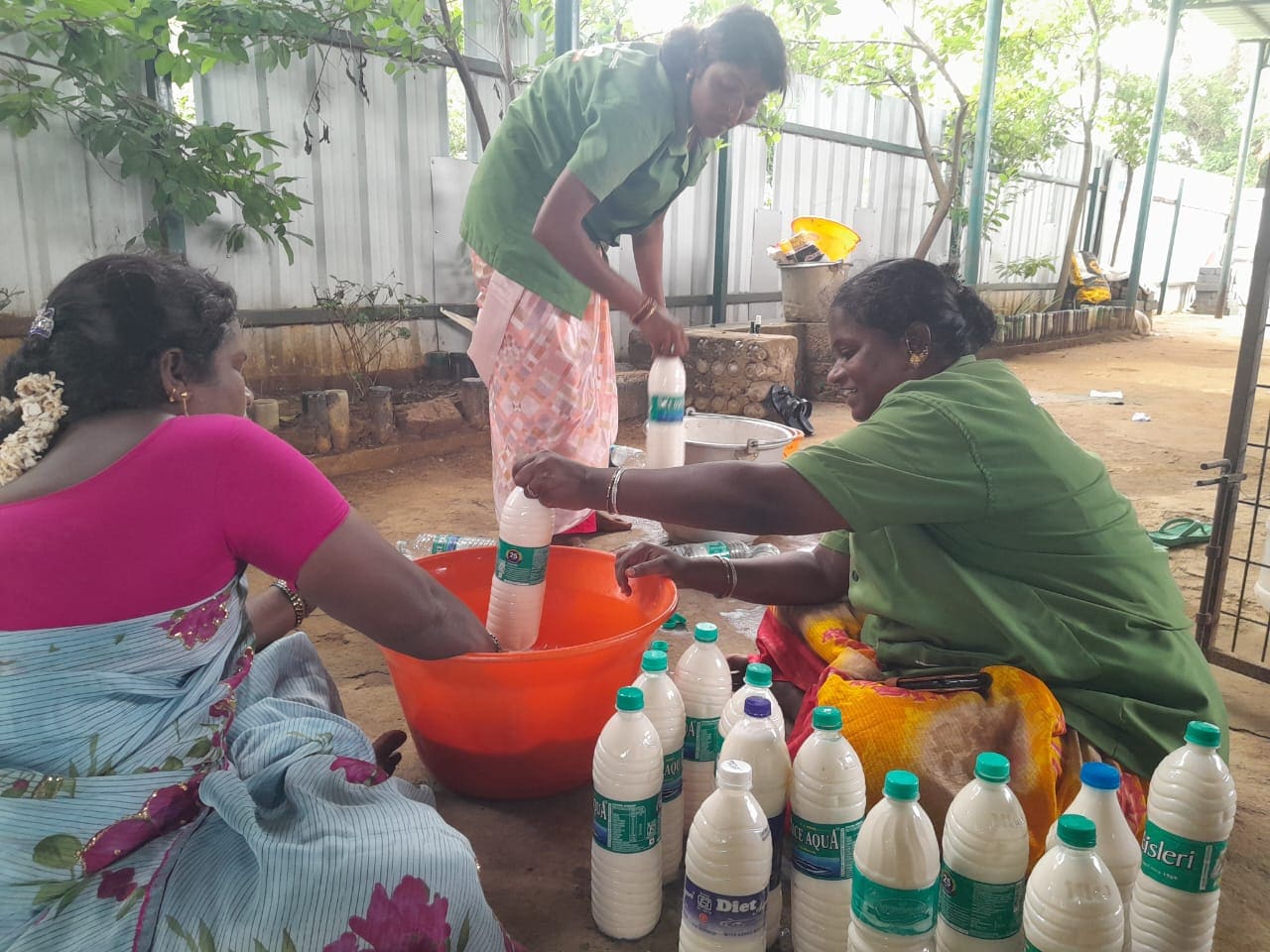 WHT women preparing produce for wealth-from-waste programs